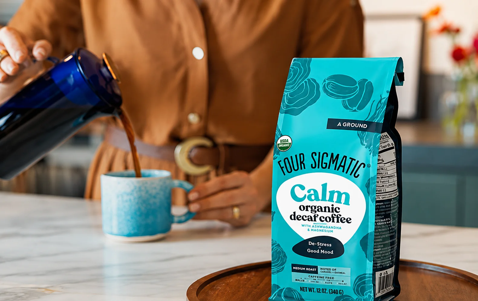 Four Sigmatic mushroom coffee bag with a prepared cup